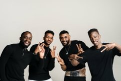 Arab, African and African American men showing world peace Product Image 1
