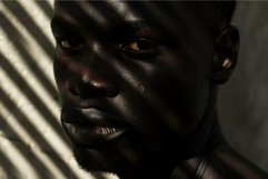 Dramatic shadow portrait of a young man Product Image 1