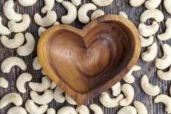 peeled cashews in a wooden plate Product Image 1