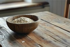 Wooden bowl of raw oats on rustic table Product Image 1