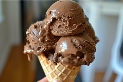 Chocolate ice cream cone melting in hand Product Image 1