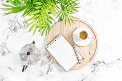 Home office workplace with notebook, coffee, green plant Product Image 1