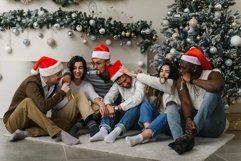 Friends at the Christmas tree are fooling around Product Image 1