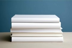Stack of plain white books on table Product Image 1