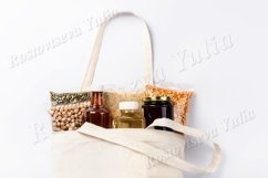 Vegan food supplies in reusable bag on white background Product Image 1