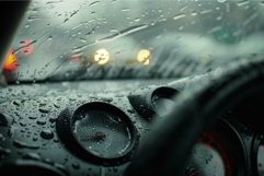 Car dashboard getting wet from rain while driving at night Product Image 1