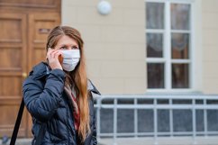 woman wears medical mask in the empty street. Product Image 1