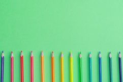 School and office supplies on office table, green background Product Image 1