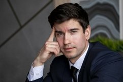 portrait of a businessman in a dark blue suit in the office Product Image 1