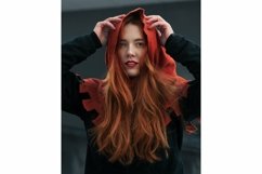 Portrait of beautiful red-haired young woman in hood Product Image 1