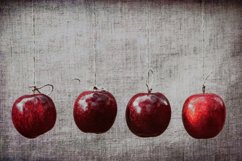 Autumn red apples hung on a linen cloth background Product Image 1