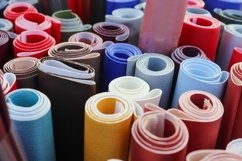 Rolled fabric samples found on a market - background Product Image 1