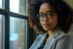 Confident young businesswoman posing in modern office Product Image 1