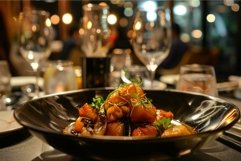 Gourmet dinner plate in elegant restaurant setting Product Image 1