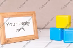 Photo of wooden frame with kid toys, child mockup Product Image 1