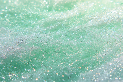 Sparkling green and white glitter with a textured background Product Image 1