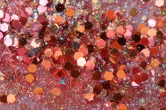 Colorful background of pink and red sequins and glitter Product Image 1