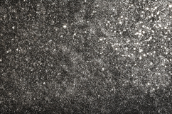 A dark textured background with white specks and particles Product Image 1
