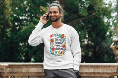 Colorful Boho floral Christian sublimation design featuring a bold white cross, hand-drawn wildflowers, and uplifting Bible verse &quot;In the Waiting, God is Working.&quot; Perfect for faith-based t-shirt printing, mugs, and wall art. This high-resolution PNG is i