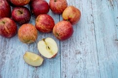 Organic ripe apples on a wooden table Product Image 1