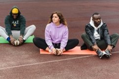 Healthy, young, diverse people stretching outdoors Product Image 1