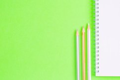 School and office supplies on office table, green background Product Image 1