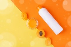 Shower gel with apricot on orange and yellow. JPG photo Product Image 1