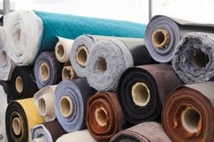 Rolled fabric samples found on a market - background Product Image 1