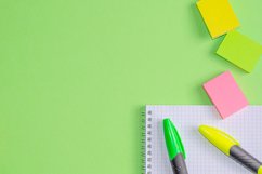 School and office supplies on office table, green background Product Image 1