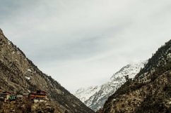 Shot of the Mountains Covered in snow under the cloudy sky Product Image 1