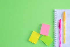 School and office supplies on office table, green background Product Image 1