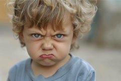 Cute toddler with a frown Product Image 1