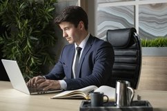 portrait of a businessman in a dark blue suit in the office Product Image 1