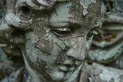 Close up of ancient stone statue face showing cracking from Product Image 1