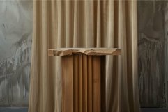 Modern minimalist wooden table against textured wall Product Image 1