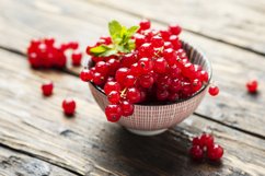Fresh Red currant with mint on thee wooden table Product Image 1