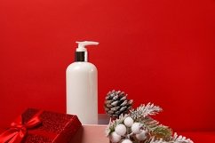 Cosmetic product lotion or shower gel in gift box on red Product Image 1