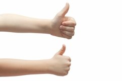 Child&#039;s hand shows like thumbs up on a white background Product Image 1