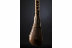Part ancient Asian stringed musical instrument on black Product Image 1