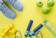Sports flat lay with jump rope, dumbbells, sneakers, water Product Image 1