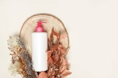 White mock up bottle without a label for cosmetics on wood Product Image 1