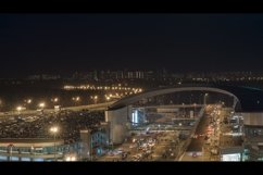 Busy car traffic in night illuminated city Product Image 1