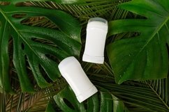 Deodorants or antiperspirants on green background Product Image 1