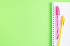 School and office supplies on office table, green background Product Image 1