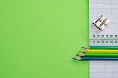 School and office supplies on office table, green background Product Image 1