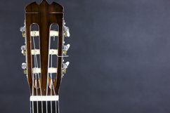 Part of a acoustic guitar on black background Product Image 1