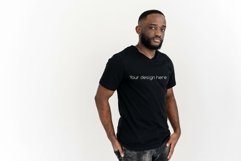 A black man in a black shirt. Side view Product Image 1