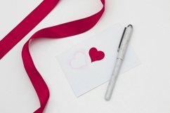 Red ribbon on a white background envelope with pen Product Image 1