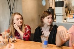Caucasian women drink coffee on a break at the university. Product Image 1