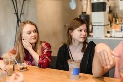 Caucasian women drink coffee on a break at the university. Product Image 1